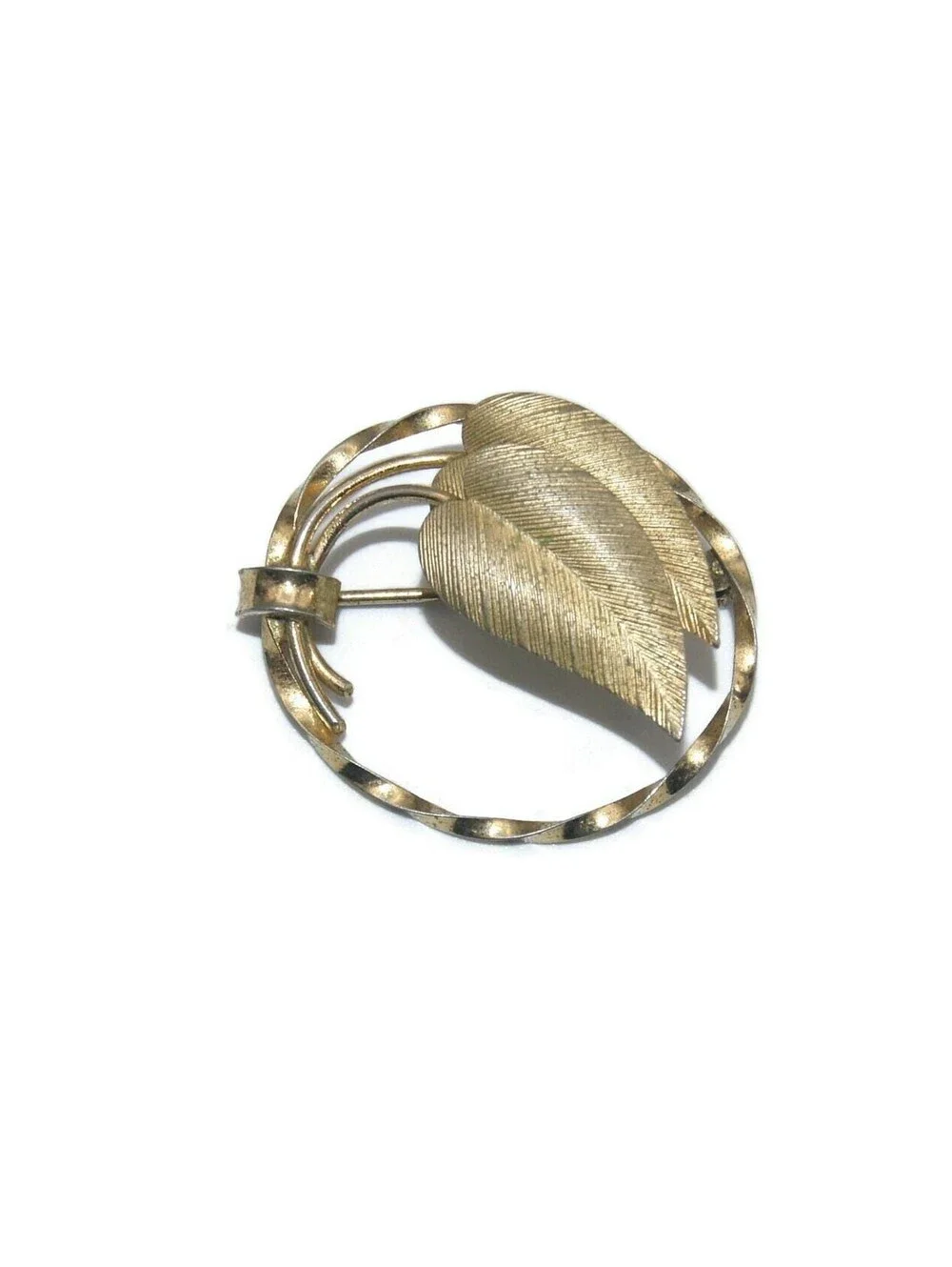 Vintage Gold Tone Brooch with Golden Leaves in a Twisted Oval Frame.